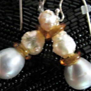 Pearls as seen in these photos are not the usual.  The Keishe Pearls shimmer.